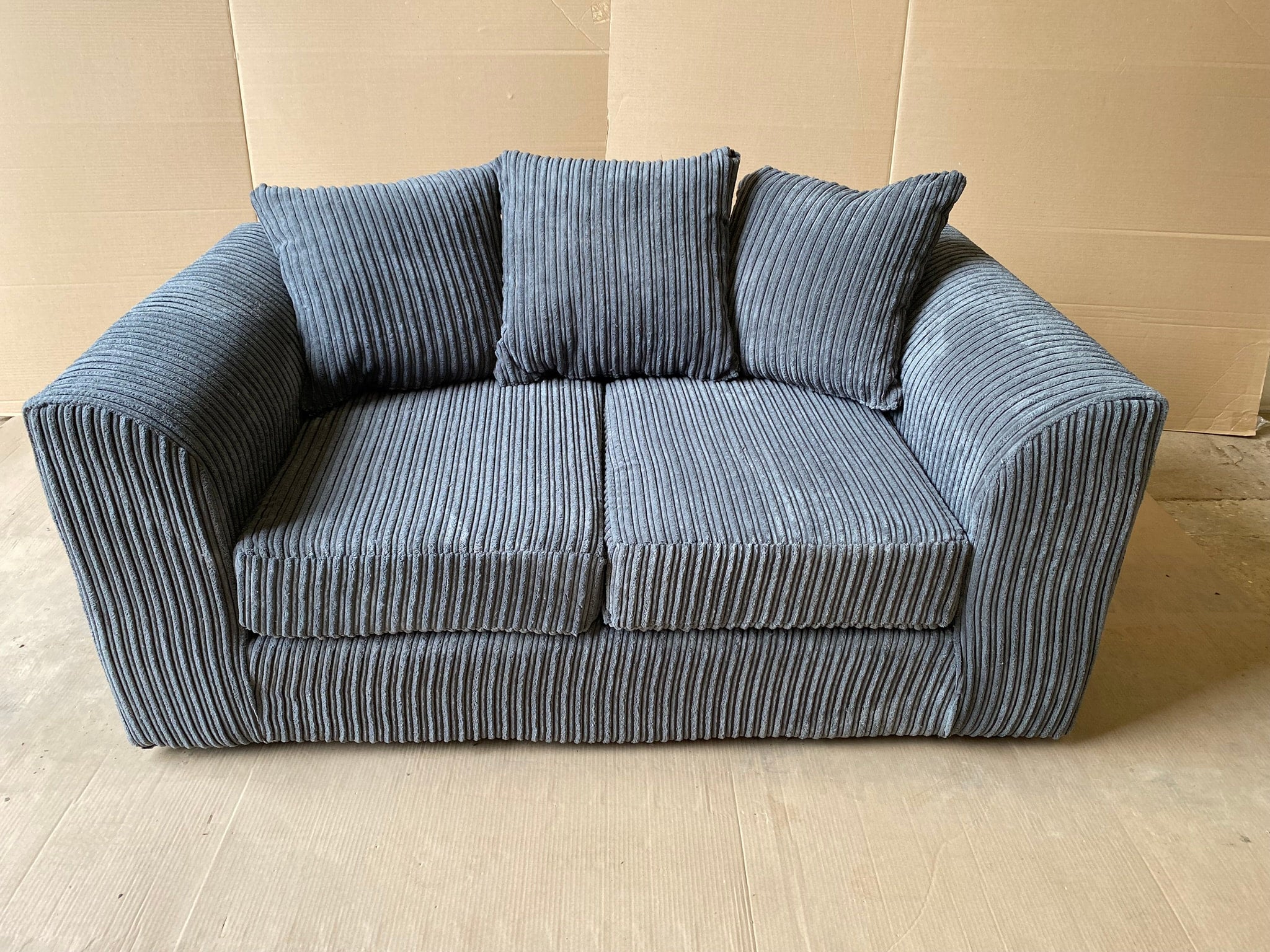 Grey jumbo shop cord sofa